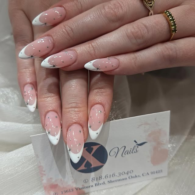 White French tip Gel-X almond nails at X Nails in Sherman Oaks